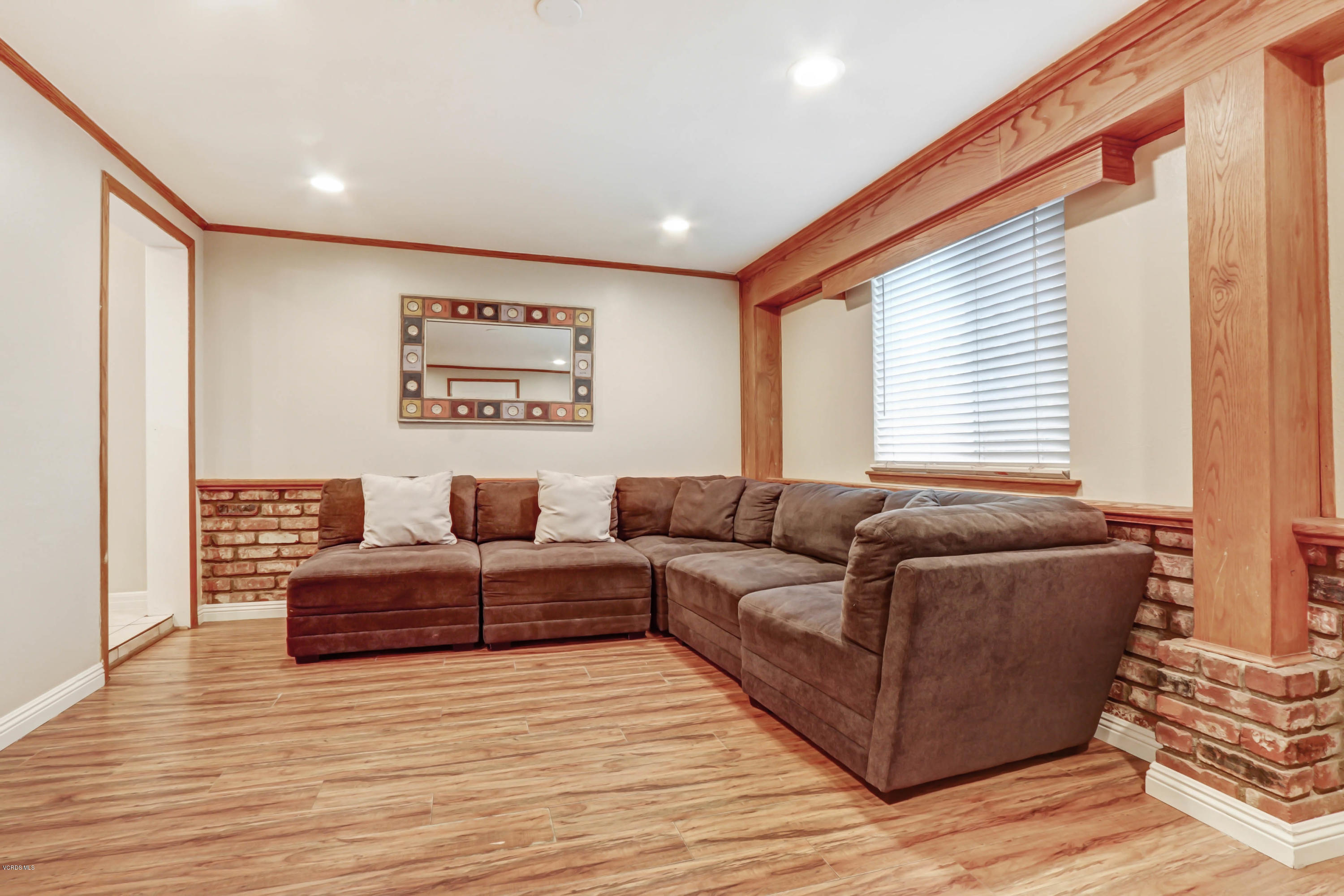 6205 Melia Street Simi Valley, CA 93063 - Photo 18 of 36 a living room with furniture and a window