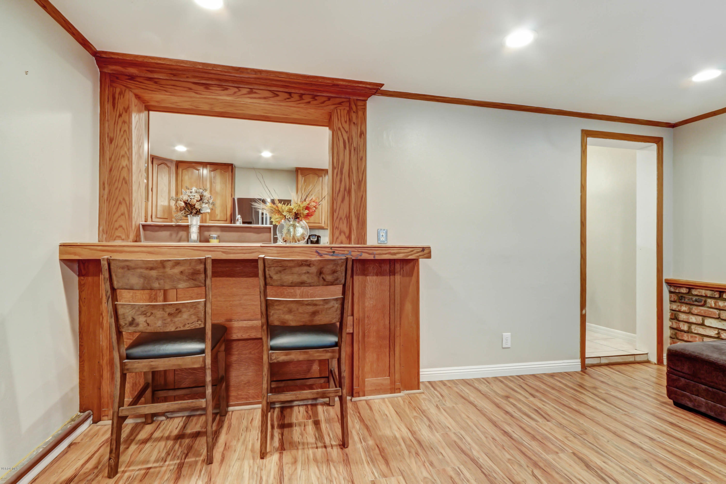 6205 Melia Street Simi Valley, CA 93063 - Photo 19 of 36 a view of a dining room with furniture and wooden floor