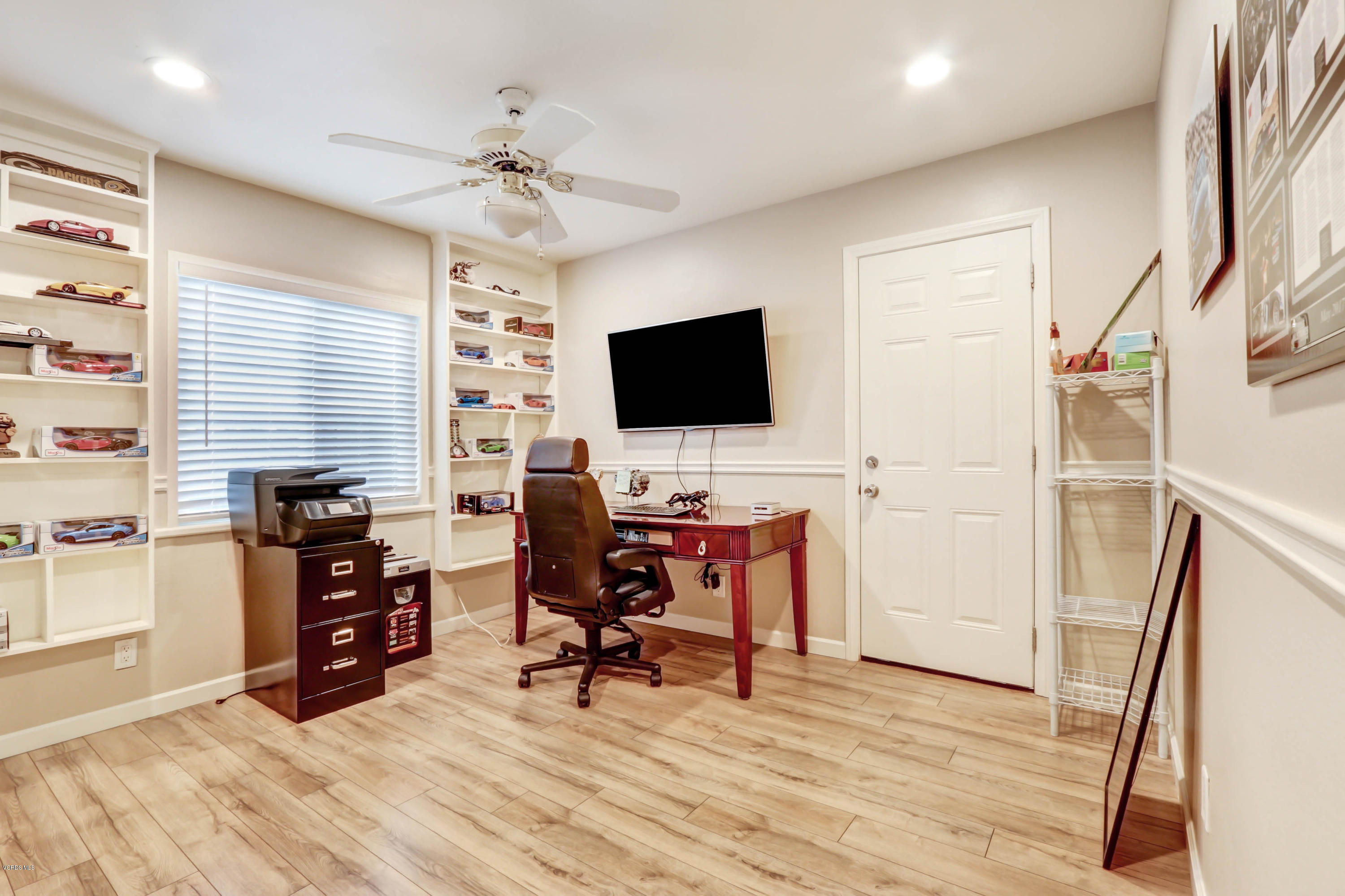6205 Melia Street Simi Valley, CA 93063 - Photo 22 of 36 a view of a workspace with furniture and a window