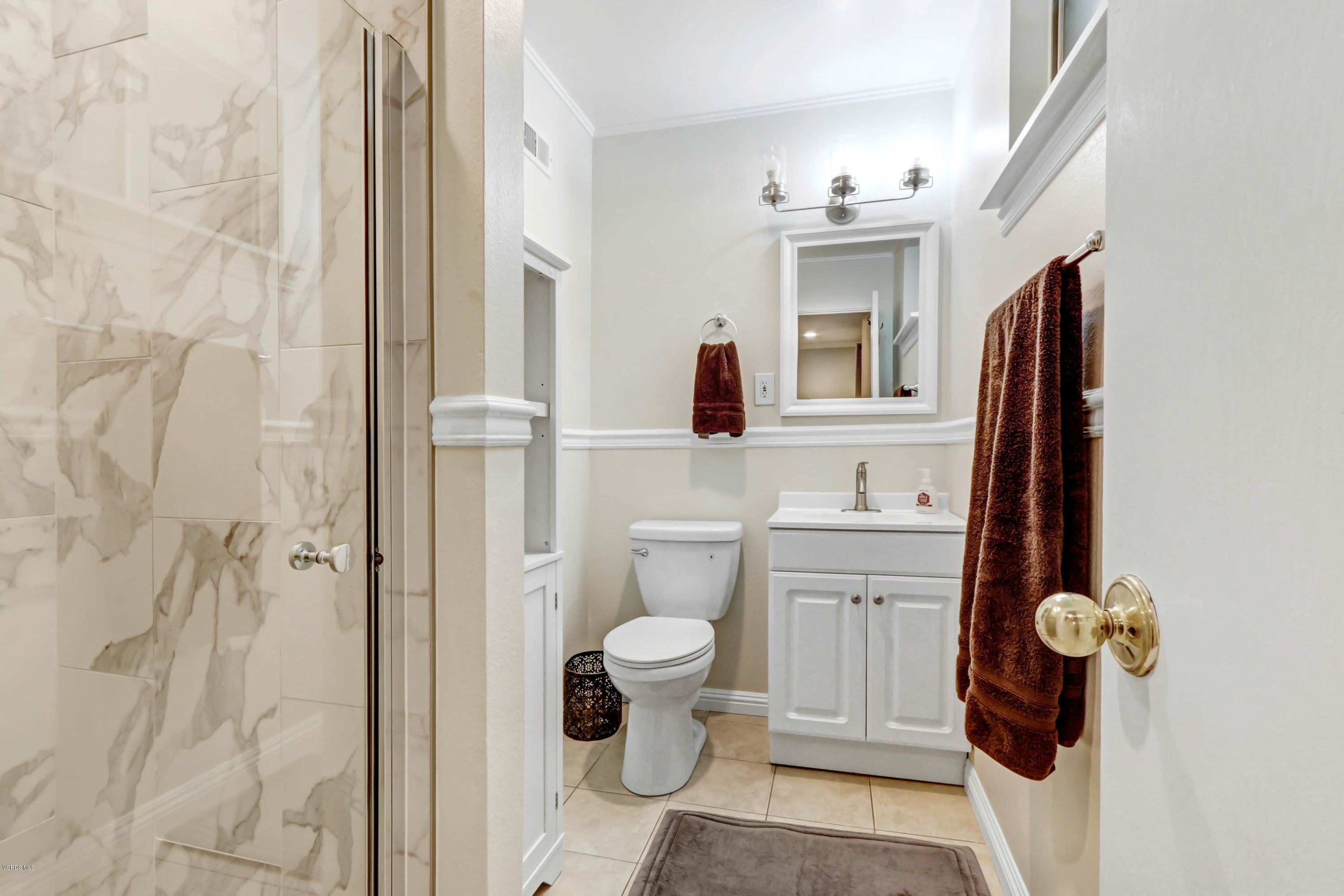 6205 Melia Street Simi Valley, CA 93063 - Photo 24 of 36 a bathroom with a toilet sink and mirror