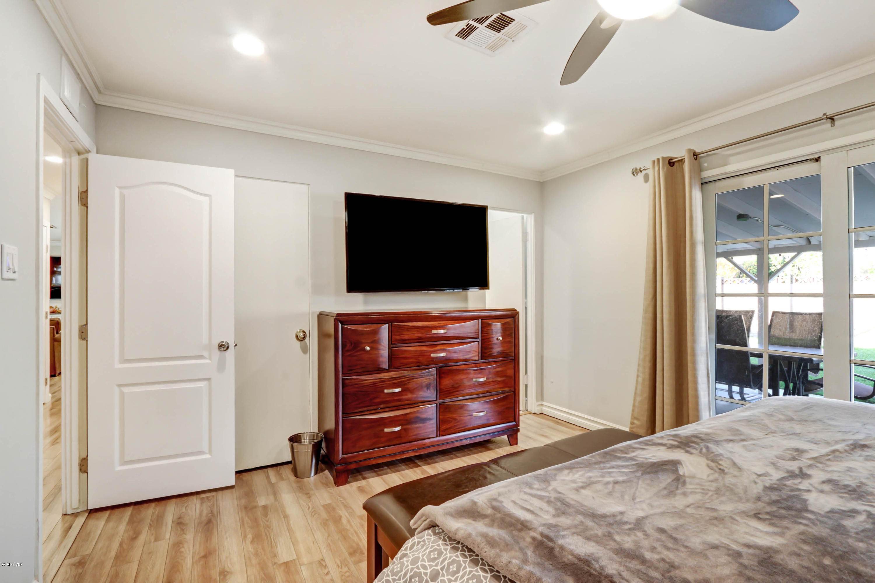 6205 Melia Street Simi Valley, CA 93063 - Photo 28 of 36 a bedroom with a bed and a flat screen tv