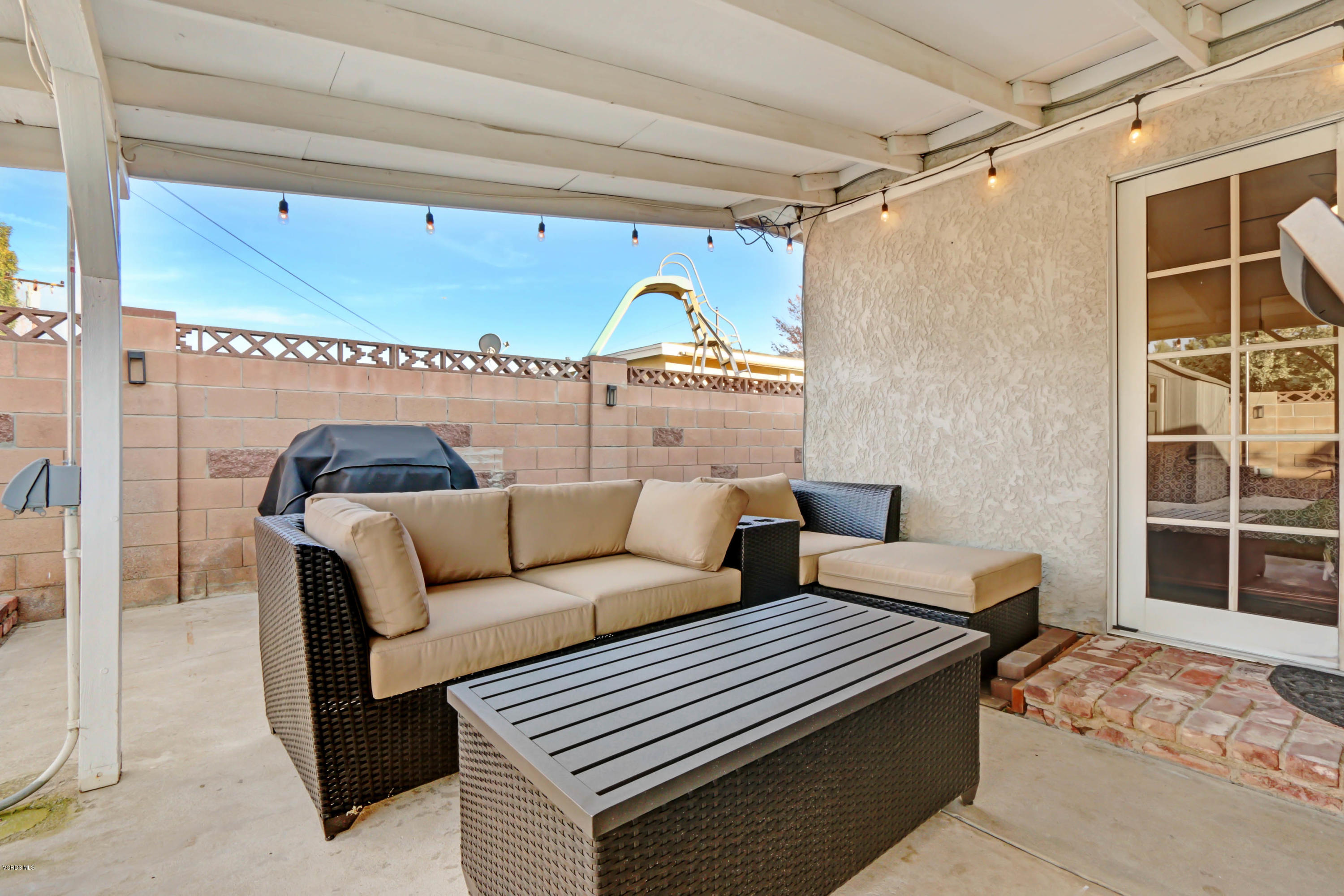 6205 Melia Street Simi Valley, CA 93063 - Photo 29 of 36 a view of a livingroom with furniture and window