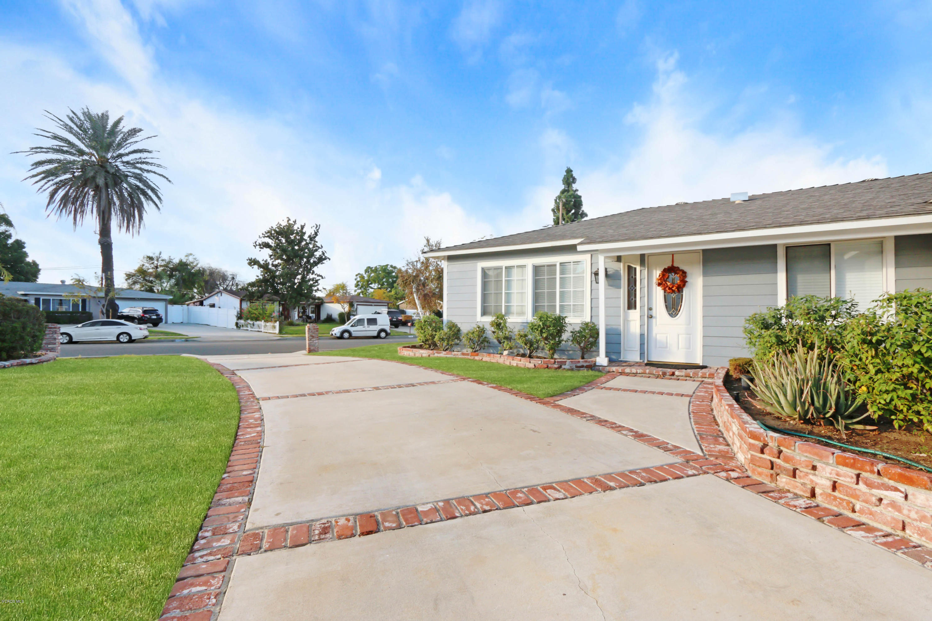 6205 Melia Street Simi Valley, CA 93063 - Photo 36 of 36 a front view of house with yard and green space