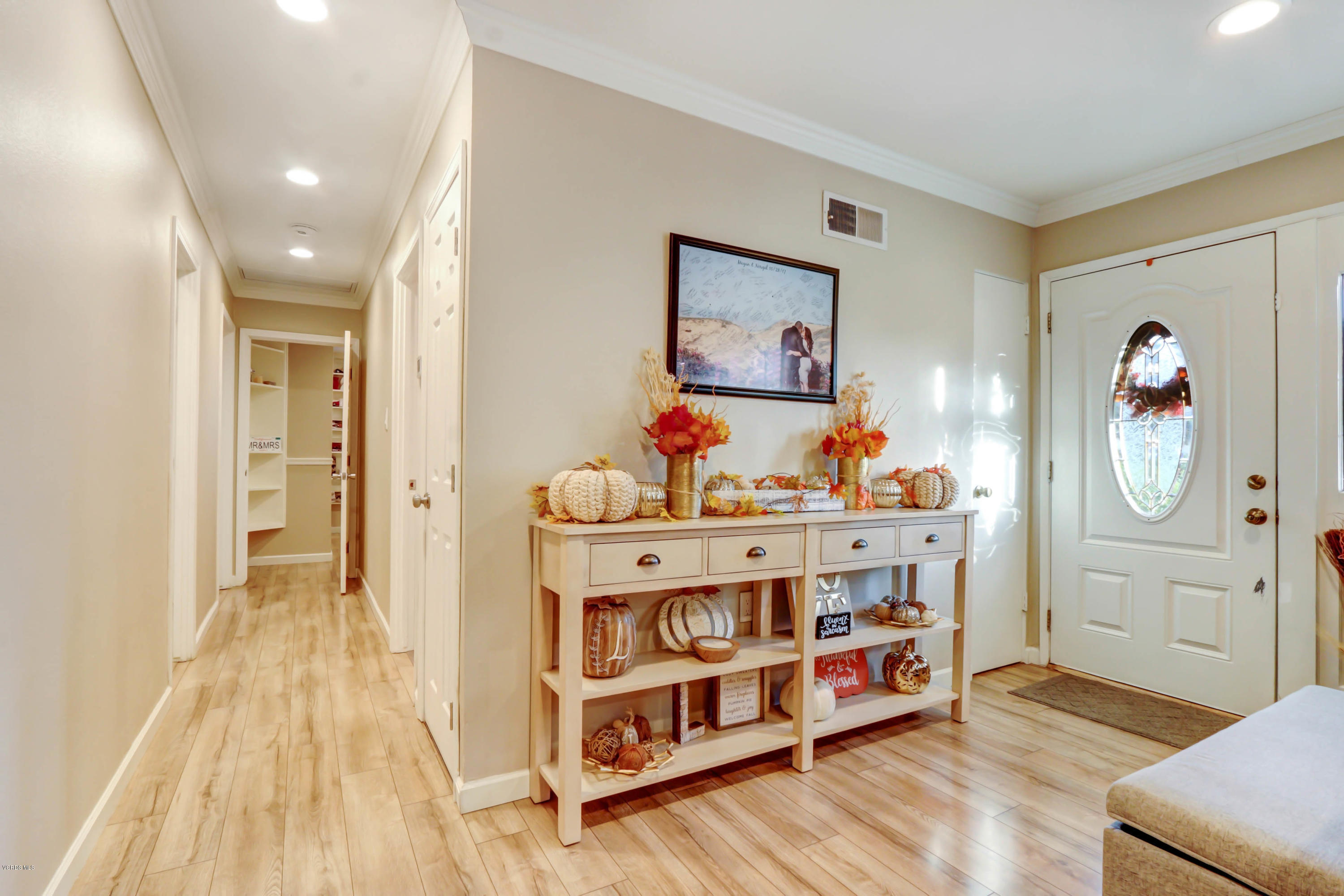 6205 Melia Street Simi Valley, CA 93063 - Photo 6 of 36 a view of a bedroom with baby crib and wooden floor
