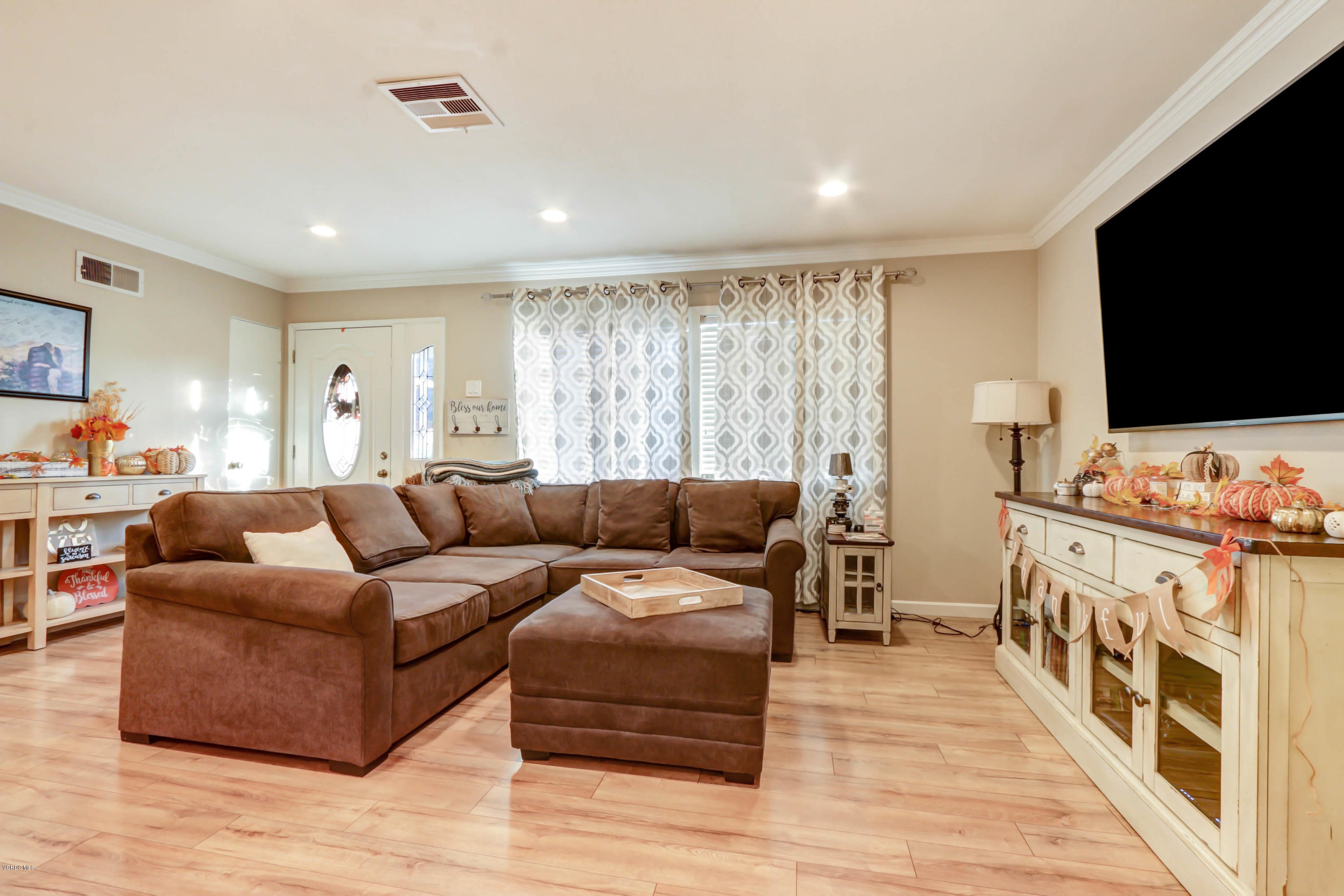 6205 Melia Street Simi Valley, CA 93063 - Photo 7 of 36 a living room with furniture and a flat screen tv