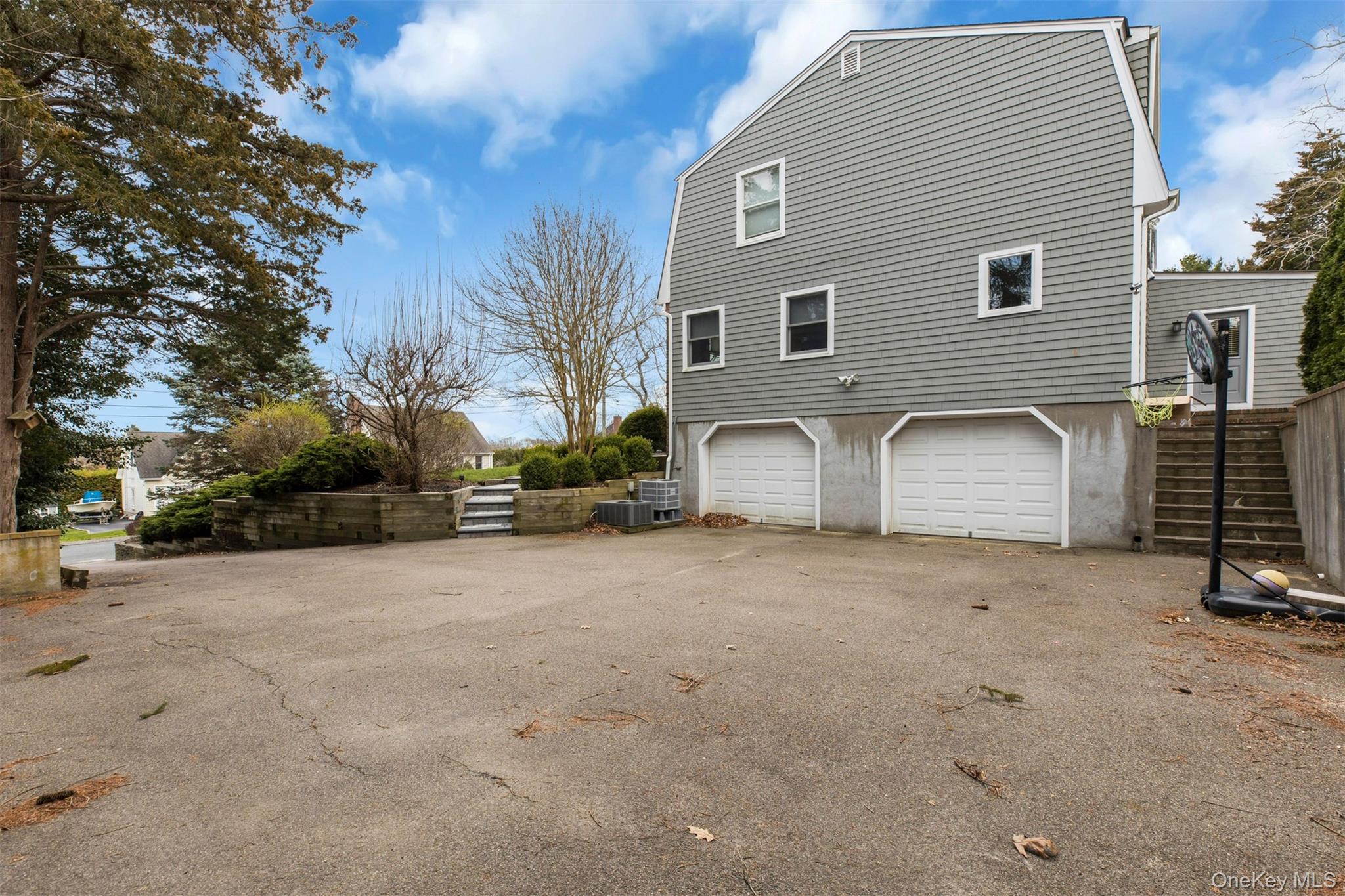 345 Colonial Road Southold, NY 11971 - Photo 30 of 43 a view of a house with backyard and a tree