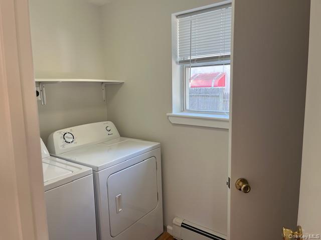 92 Harbor Road Port Washington, NY 11050 - Photo 6 of 15 Laundry area featuring baseboard heating and washer and dryer