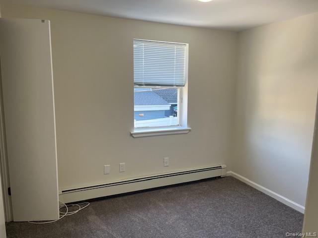 92 Harbor Road Port Washington, NY 11050 - Photo 9 of 15 Spare room with baseboard heating and carpet