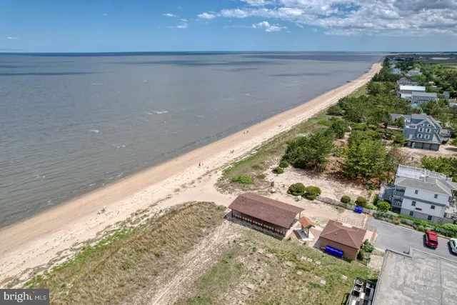 a view of a room with furniture and a window