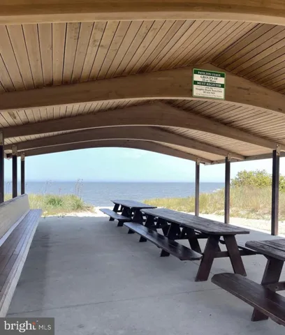 a backyard of a house with lots of green space and trees