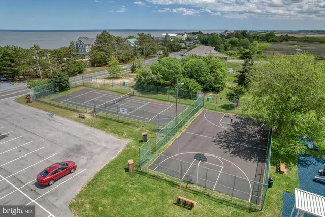 a view of a lake with a floor to ceiling window