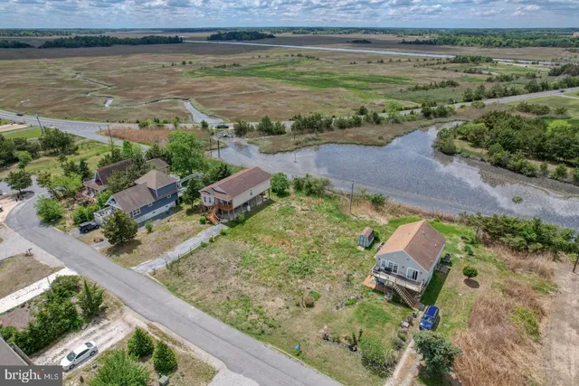 an aerial view of a yard with a barn