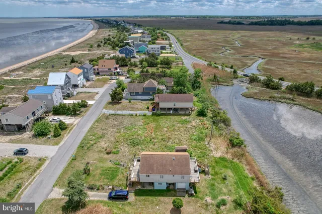 an aerial view of a residential houses and outdoor space