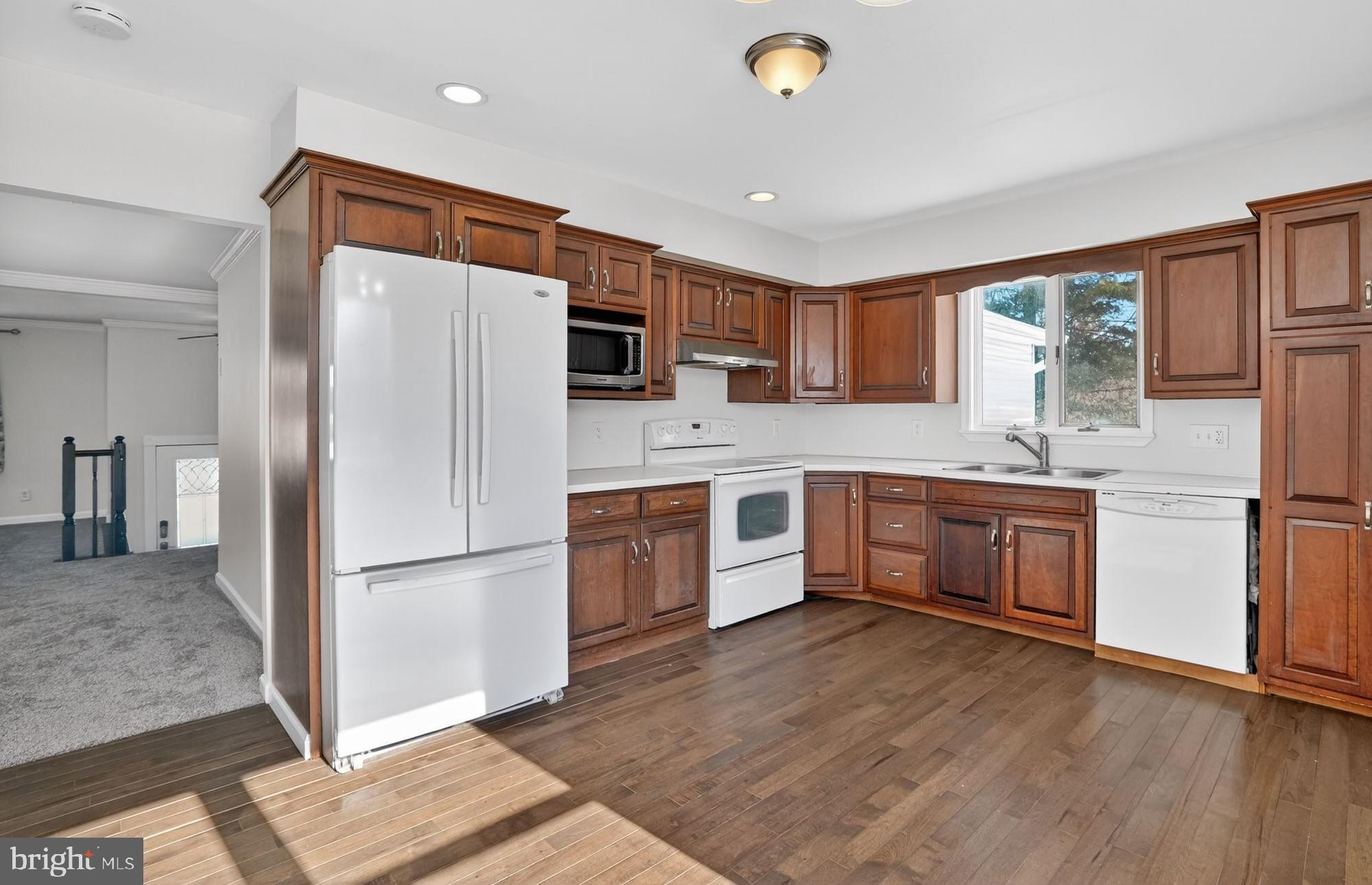 540 Martins Corner Road Coatesville, PA 19320 - Photo 6 of 33 Modern kitchen with rich wood cabinetry.