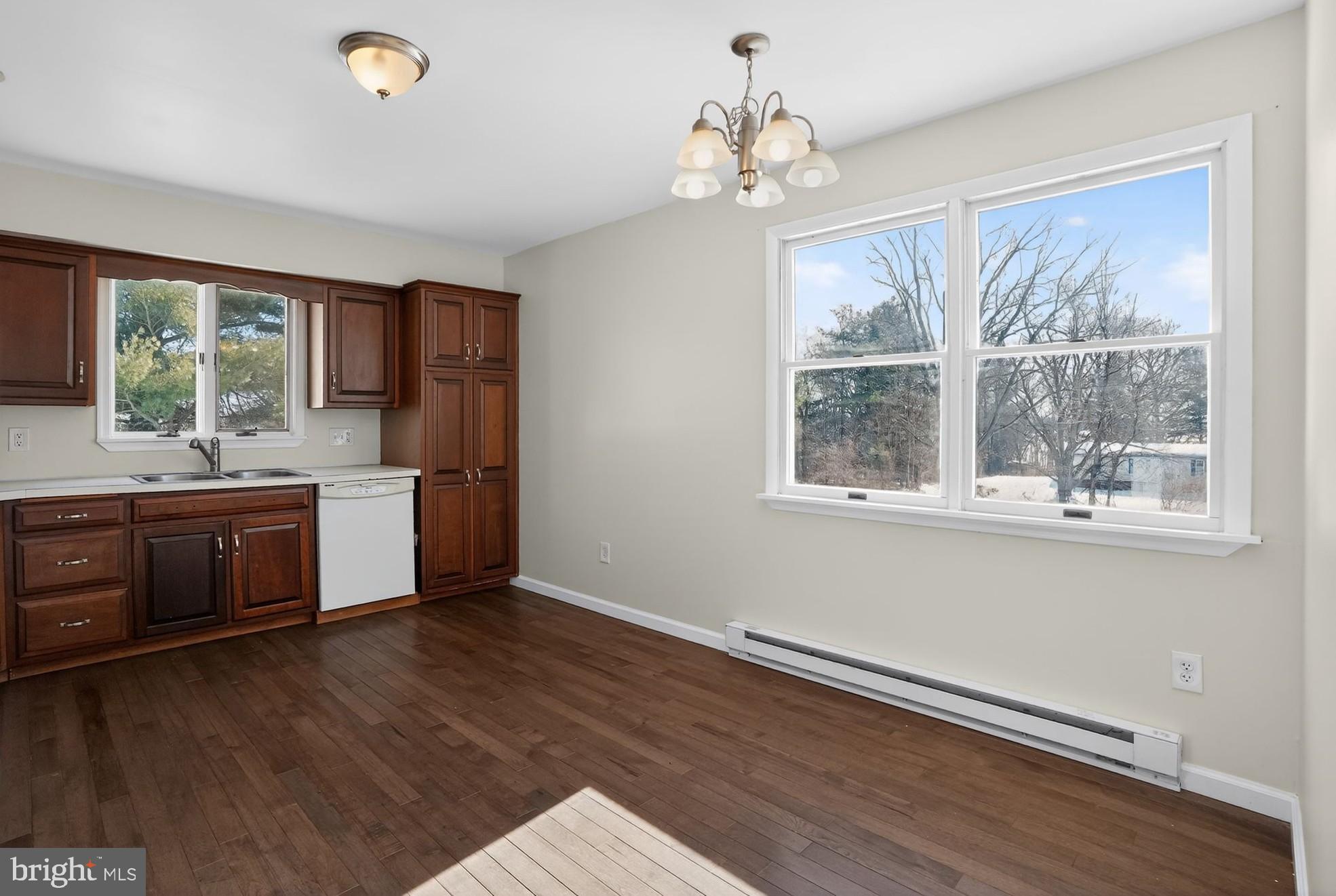 540 Martins Corner Road Coatesville, PA 19320 - Photo 9 of 33 Bright kitchen with a hardwood floor.