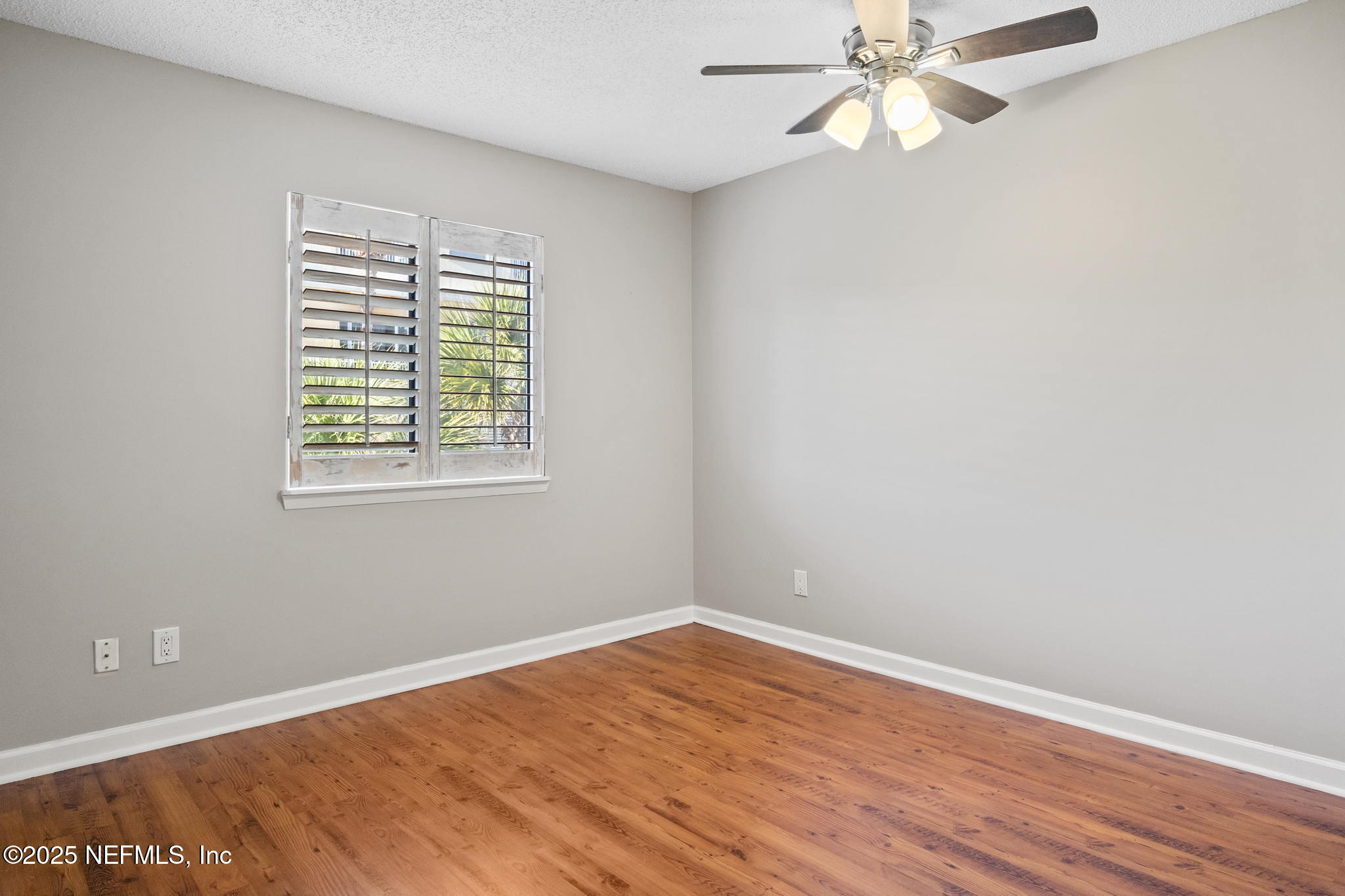 1107 1st Street South, Unit B Jacksonville Beach, FL 32250 - Photo 11 of 45 wooden floor in an empty room with a window