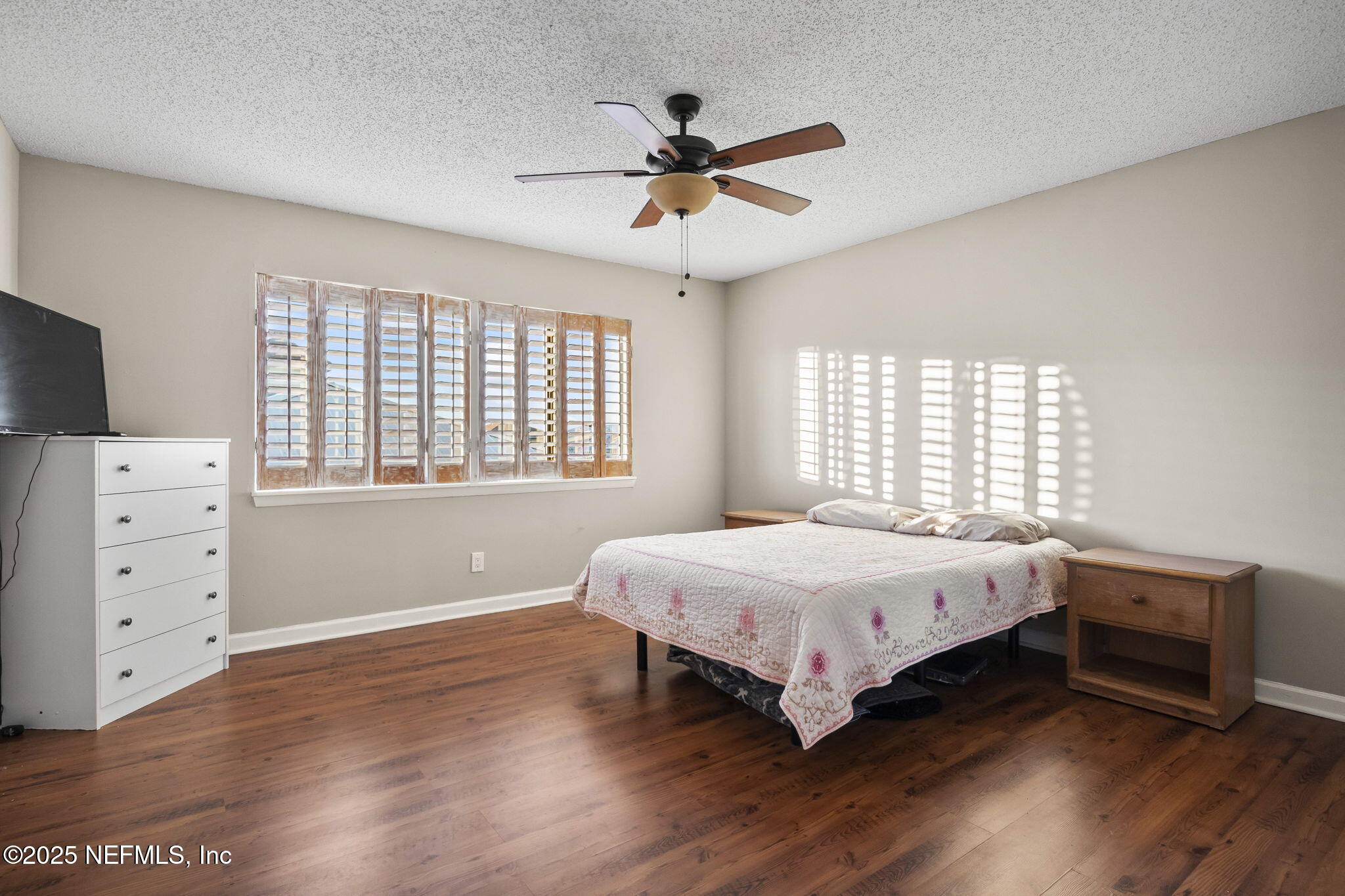 1107 1st Street South, Unit B Jacksonville Beach, FL 32250 - Photo 15 of 45 a bedroom with a bed and a window
