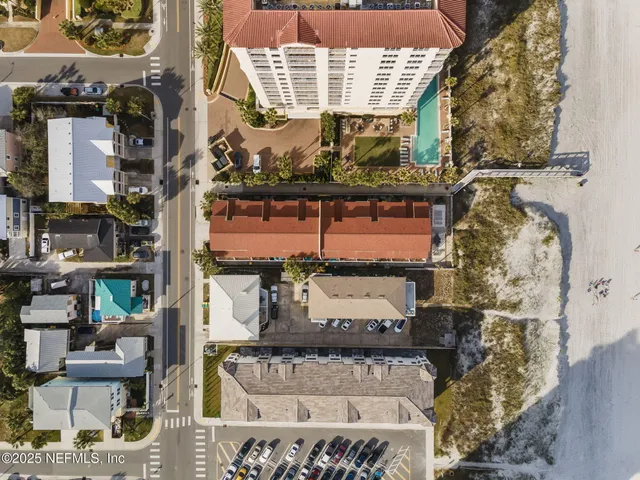 an aerial view of a houses with outdoor space