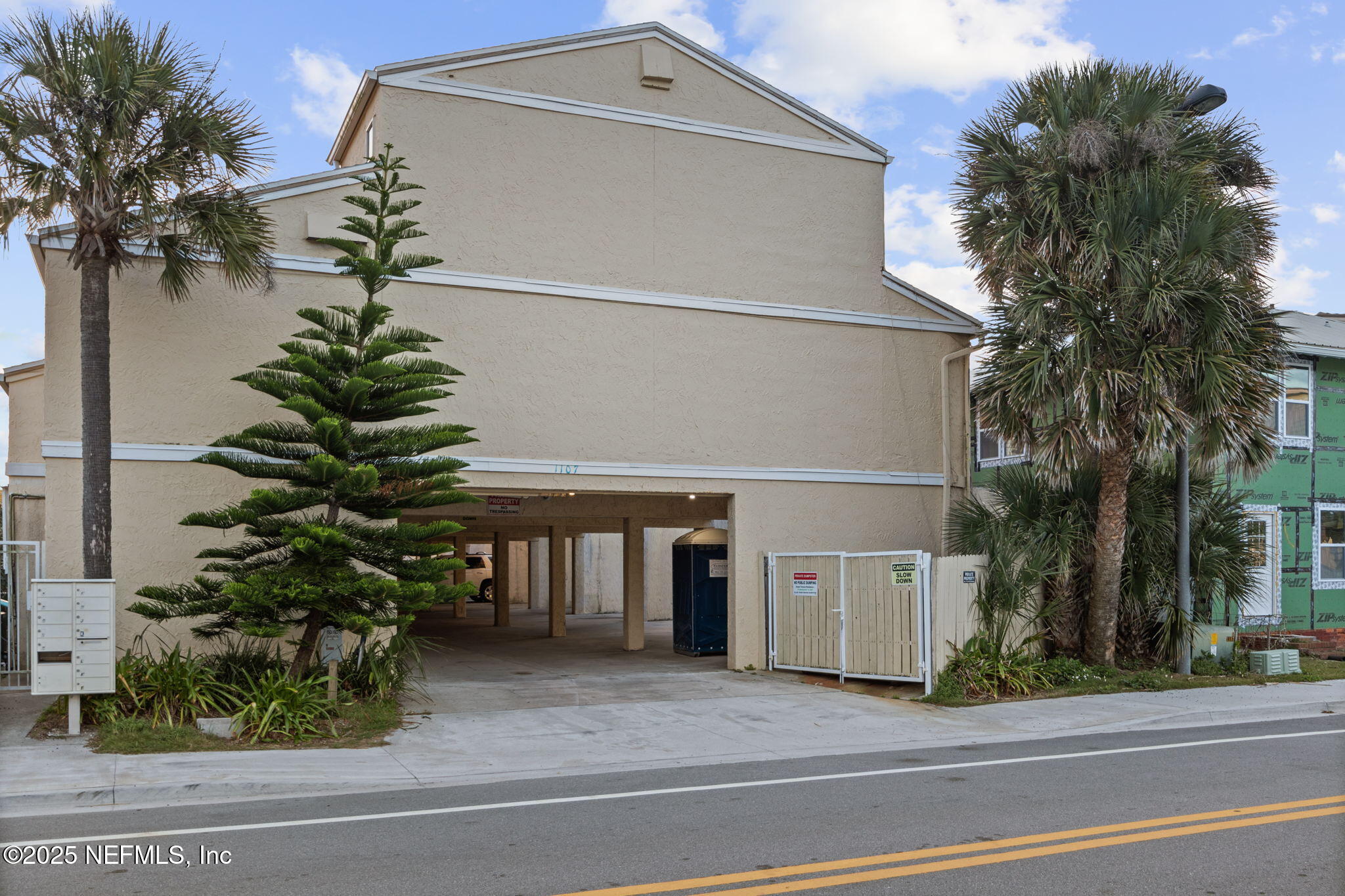 1107 1st Street South, Unit B Jacksonville Beach, FL 32250 - Photo 31 of 45 a front view of a house with a yard and garage