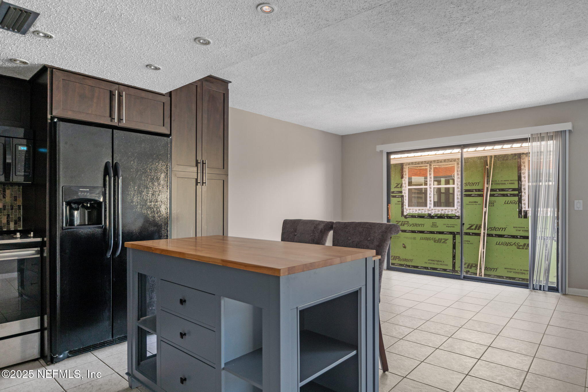 1107 1st Street South, Unit B Jacksonville Beach, FL 32250 - Photo 32 of 45 a kitchen with a refrigerator a sink and a stove