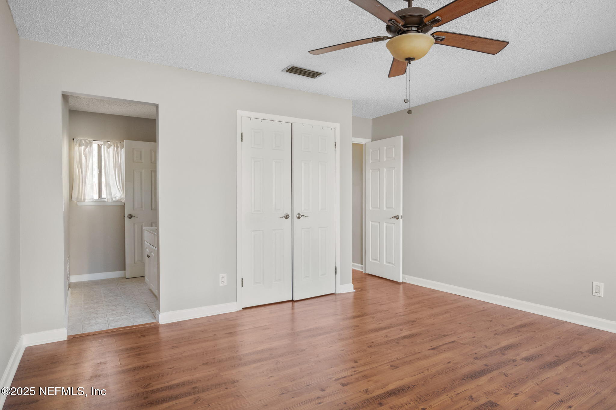 1107 1st Street South, Unit B Jacksonville Beach, FL 32250 - Photo 35 of 45 a view of an empty room with wooden floor