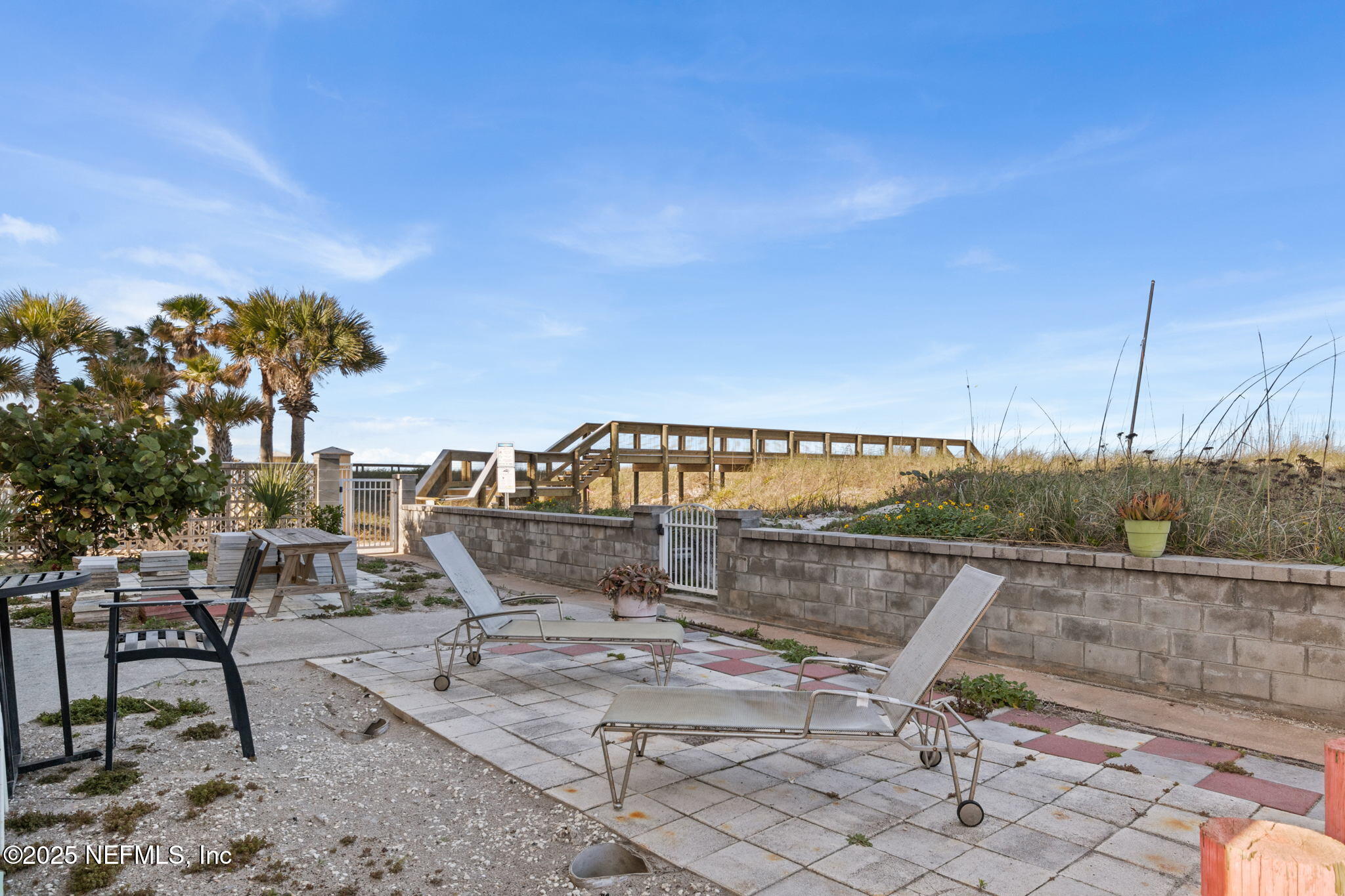 1107 1st Street South, Unit B Jacksonville Beach, FL 32250 - Photo 36 of 45 a view of a swimming pool with a lounge chair
