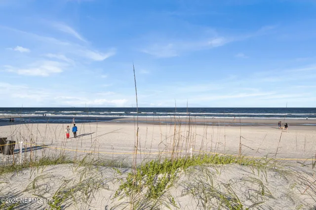a aerial view of a building with plants and large trees