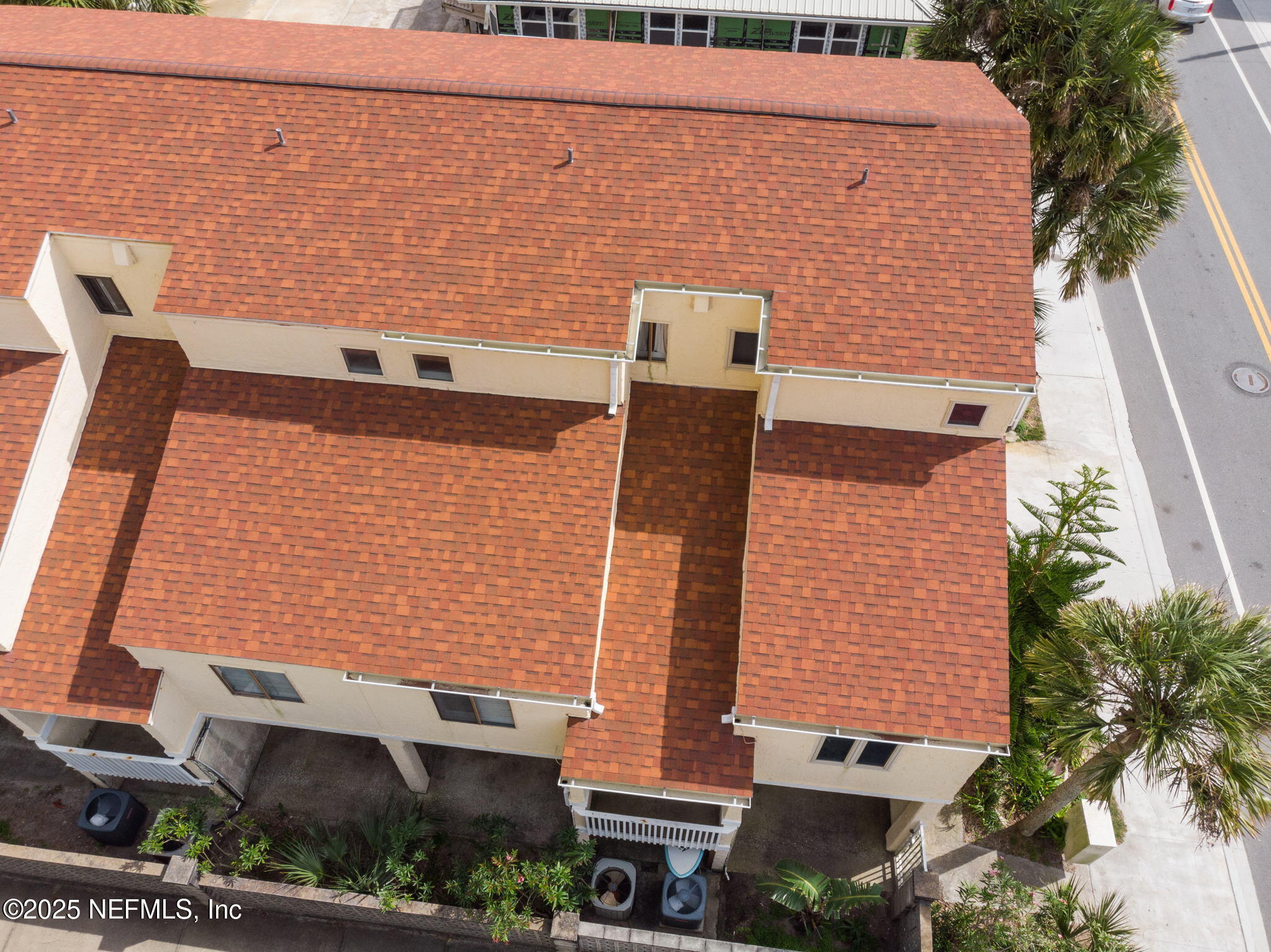 1107 1st Street South, Unit B Jacksonville Beach, FL 32250 - Photo 40 of 45 a aerial view of a building with plants and large trees