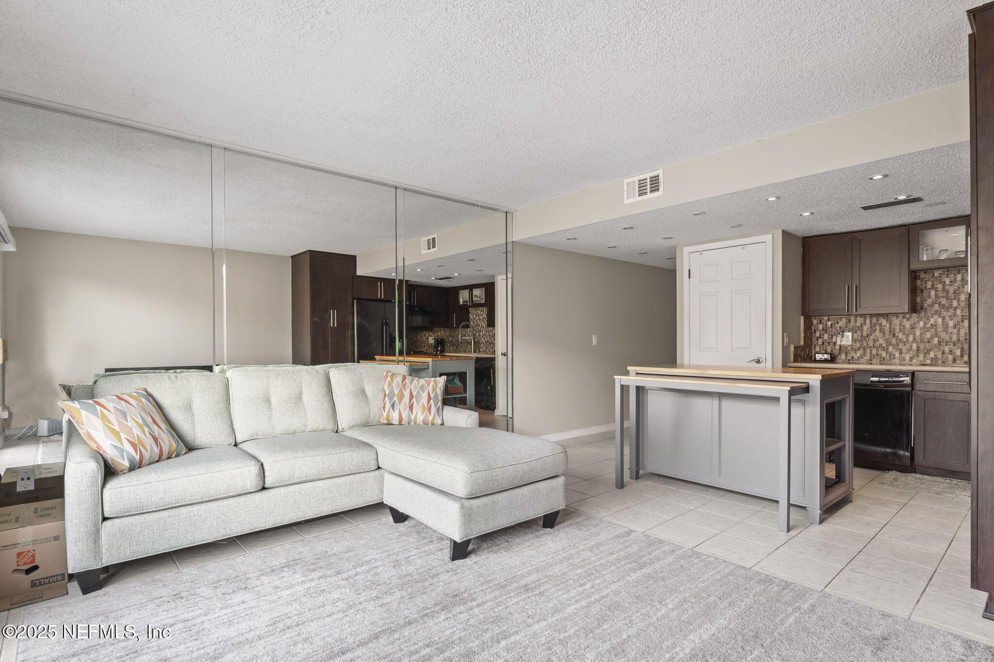 1107 1st Street South, Unit B Jacksonville Beach, FL 32250 - Photo 9 of 45 a living room with furniture and kitchen view