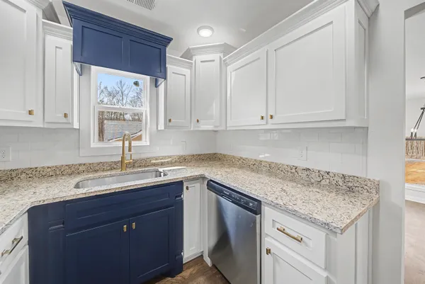 a view of a hallway with washer and dryer