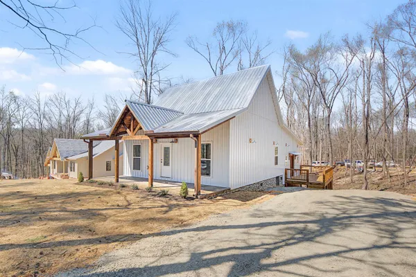 a view of a house with snow on the background