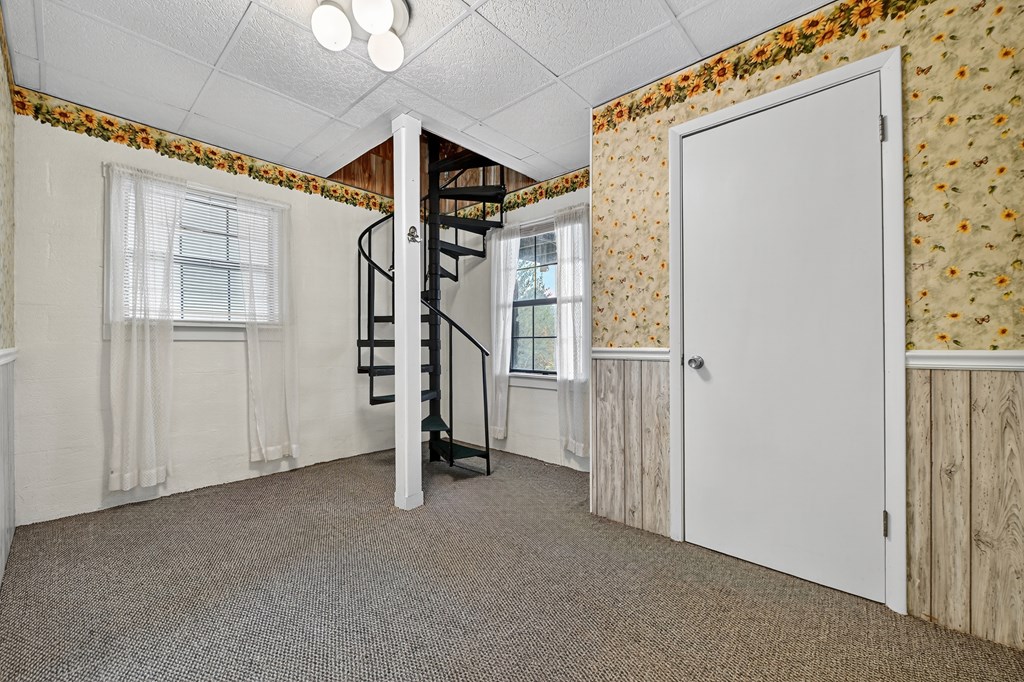 654 Stover Knob Trail Cherry Log, GA 30522 - Photo 20 of 44 a view of an empty room with stairs
