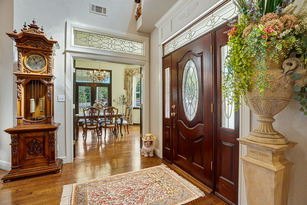 1009 Southeast County Road Ada, OK 74820 - Photo 10 of 92 Mahogany front door with oval leaded glass insert and flanking sidelights