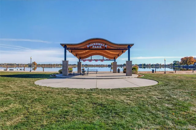 a swimming pool with outdoor seating and yard