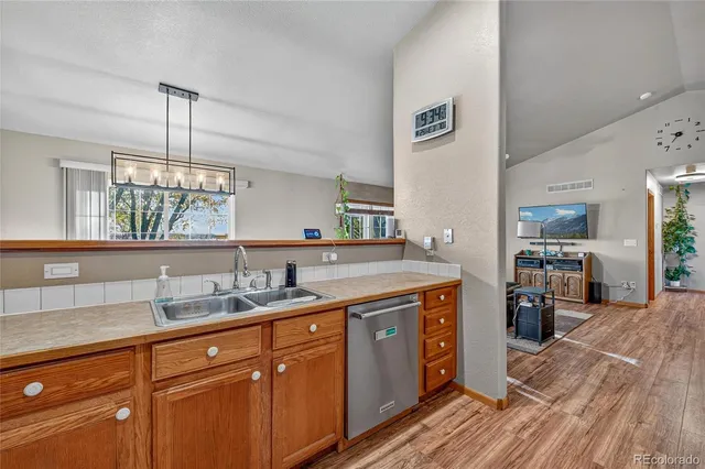 a spacious bathroom with a granite countertop sink and a mirror