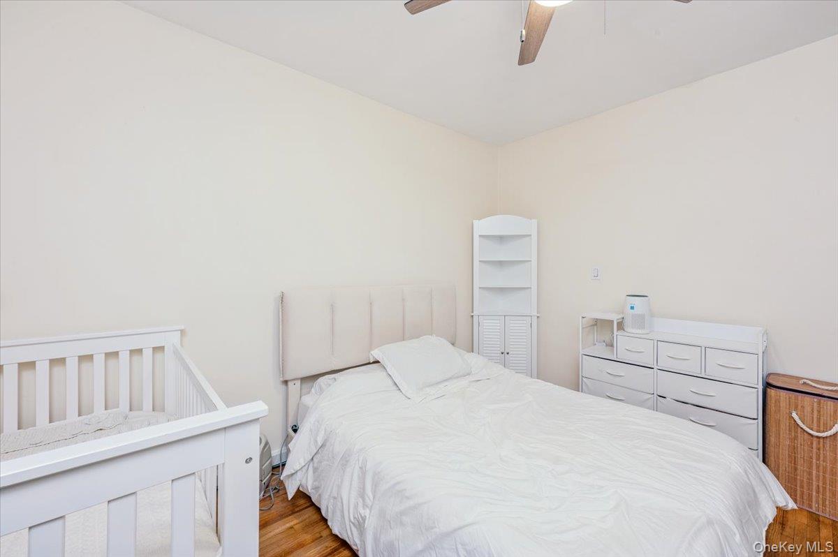 600 Pelham Road, Unit A2D New Rochelle, NY 10805 - Photo 12 of 19 Bedroom with light wood finished floors and a ceiling fan