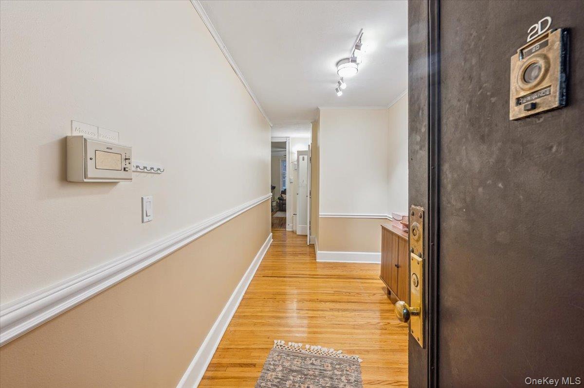 600 Pelham Road, Unit A2D New Rochelle, NY 10805 - Photo 7 of 19 Corridor with light wood-style flooring and crown molding