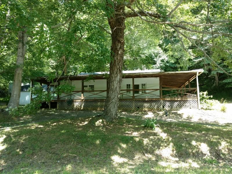 2863 Conner Grove Road Southwest Willis, VA 24380 - Photo 1 of 13 a backyard of a house with lots of green space