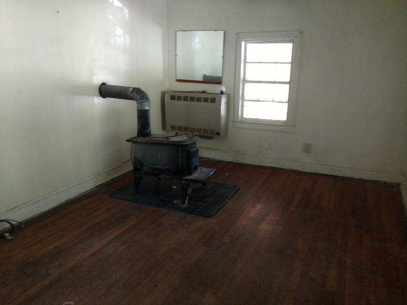 2863 Conner Grove Road Southwest Willis, VA 24380 - Photo 5 of 13 a room with wooden floor and a window
