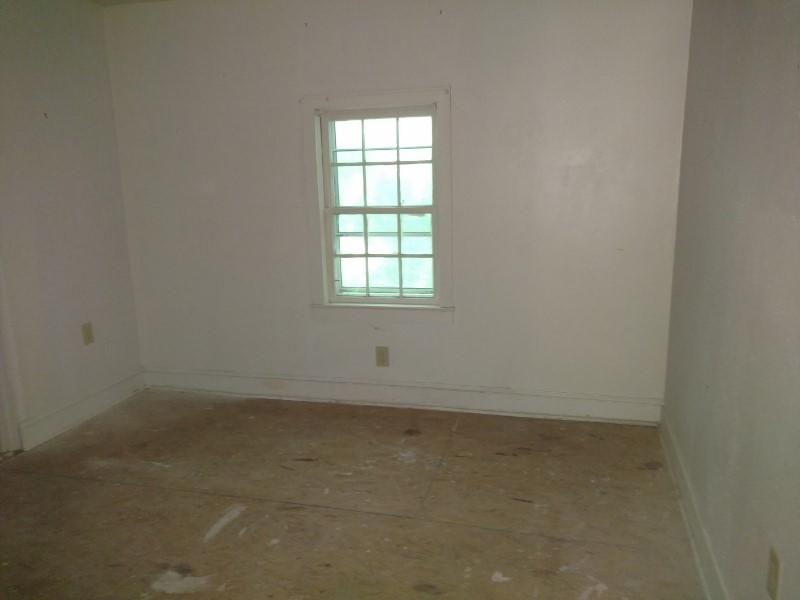 2863 Conner Grove Road Southwest Willis, VA 24380 - Photo 9 of 13 an empty room with a window