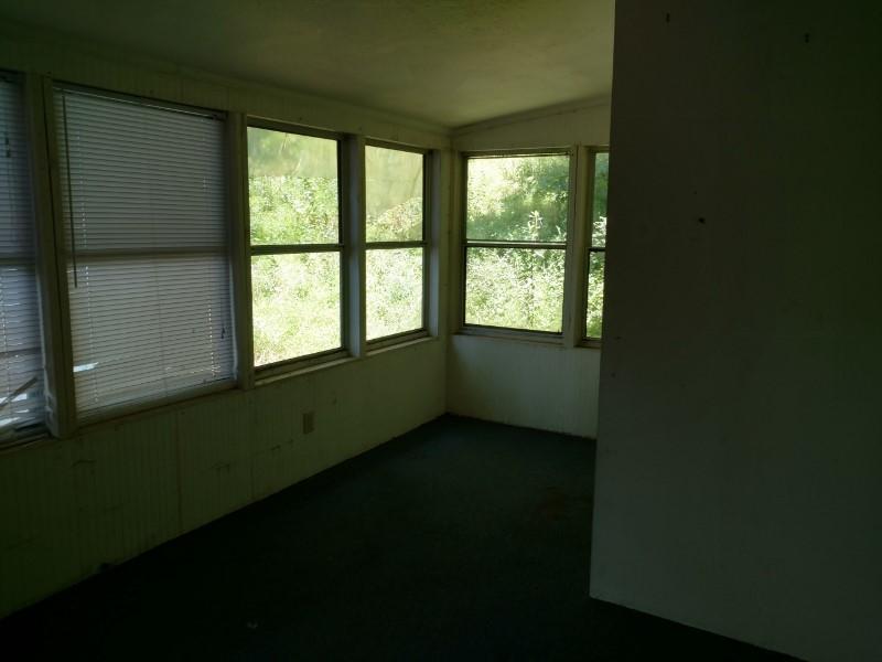 2863 Conner Grove Road Southwest Willis, VA 24380 - Photo 10 of 13 a view of an empty room with a window