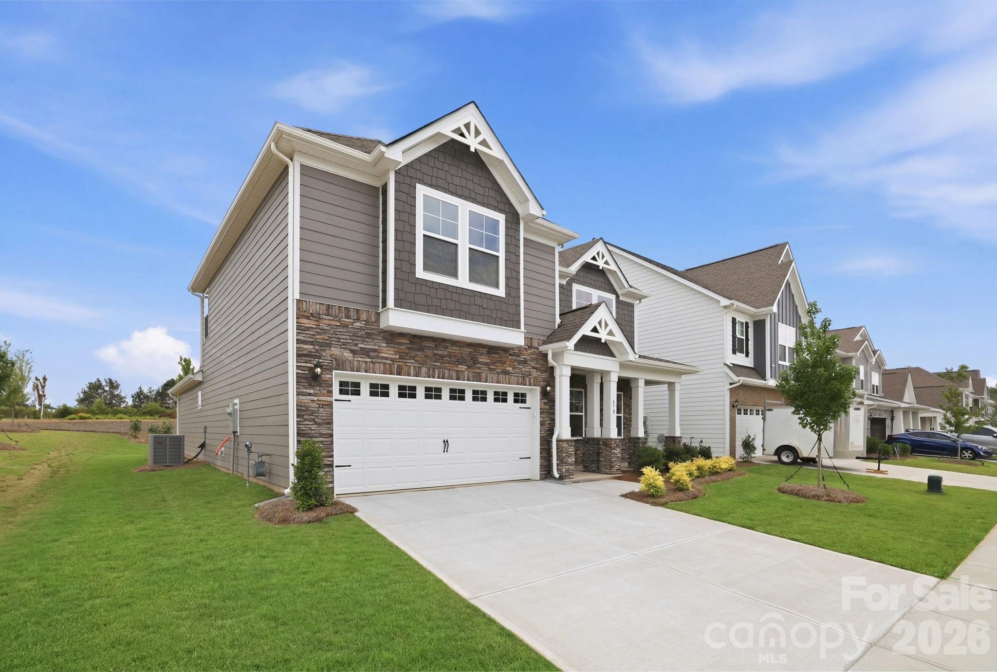 470 Brick House Road York, SC 29745 - Photo 2 of 39 a front view of a house with a garden and yard