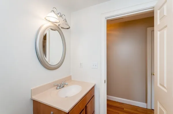 a bathroom with a sink a vanity and a mirror