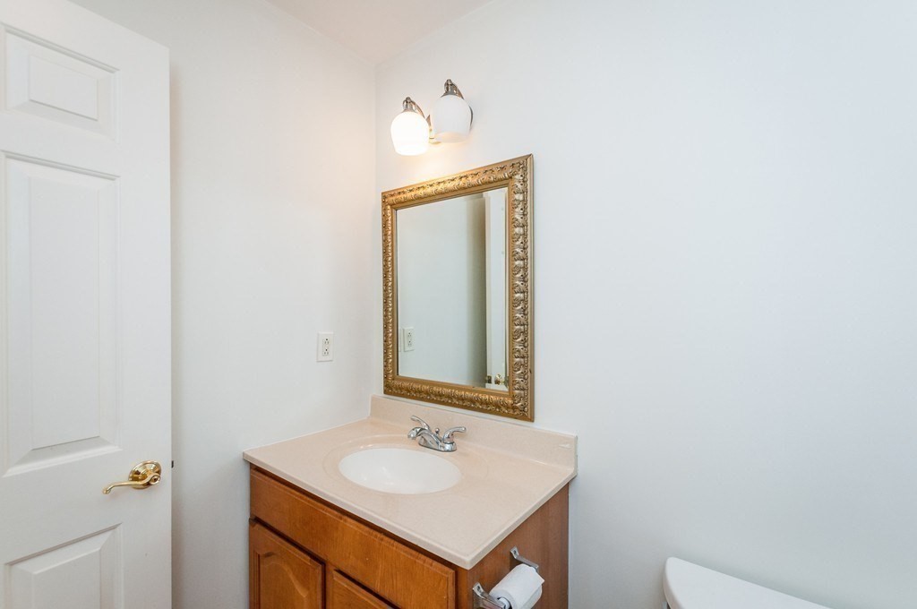 232 Pearl Street, Unit 232 Newton, MA 02458 - Photo 27 of 27 a bathroom with a sink and a mirror