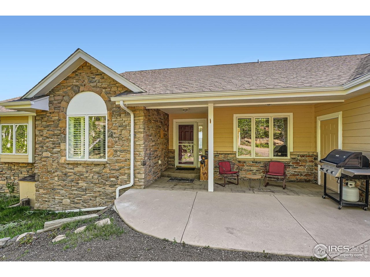 557 Highpoint Circle Black Hawk, CO 80422 - Photo 1 of 32 a front view of a house with outdoor seating
