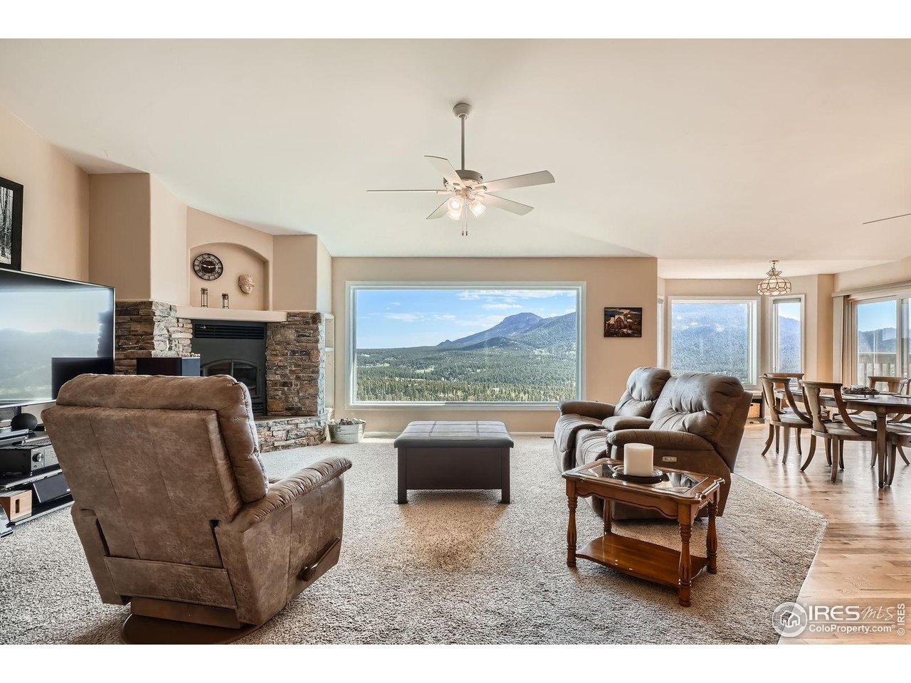 557 Highpoint Circle Black Hawk, CO 80422 - Photo 3 of 32 a living room with furniture and a fireplace