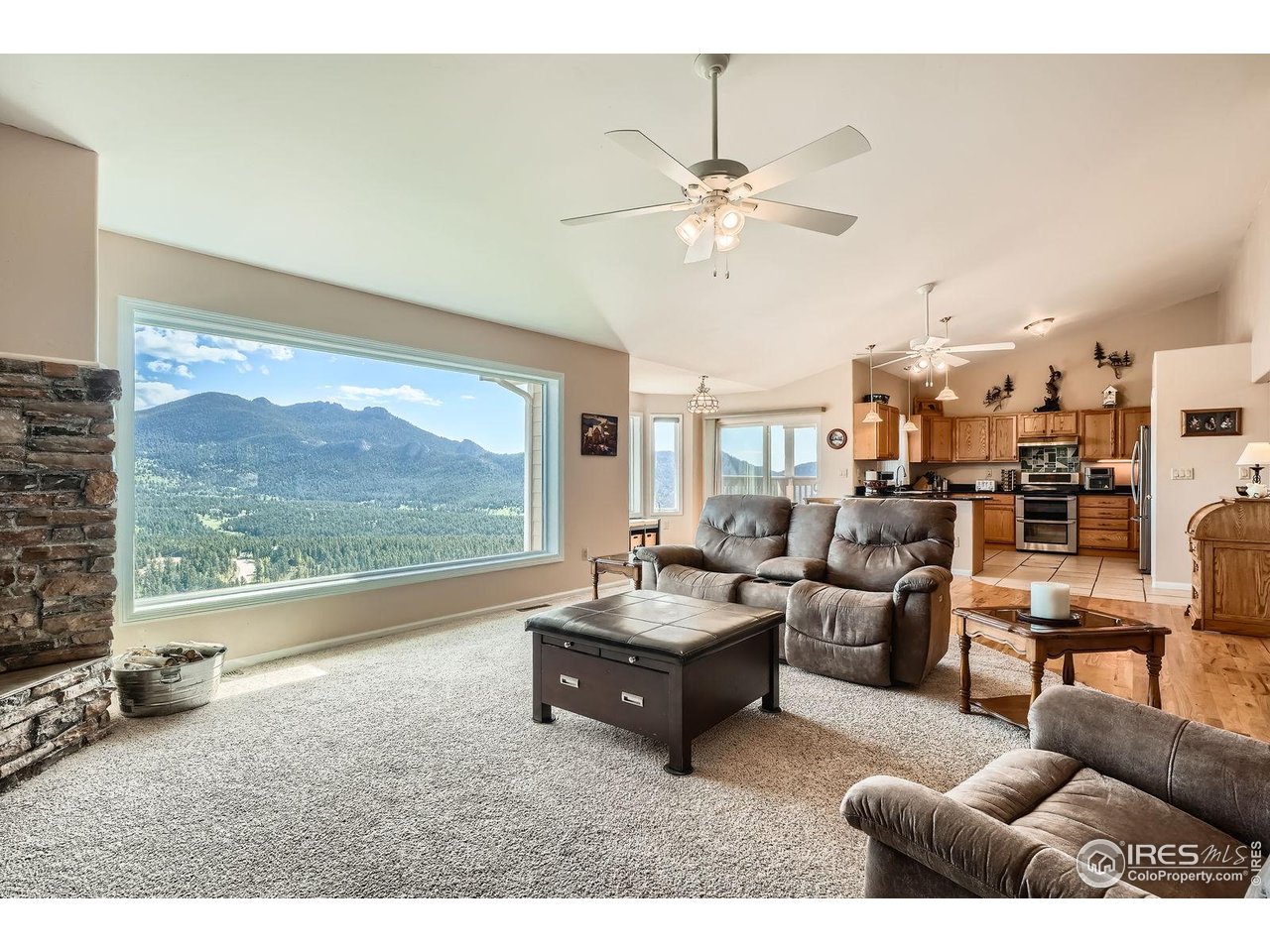 557 Highpoint Circle Black Hawk, CO 80422 - Photo 4 of 32 a living room with furniture and a large window