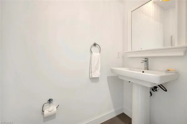a bathroom with a sink and mirror