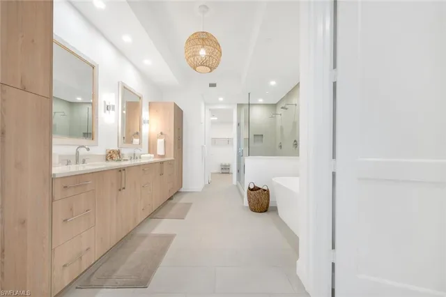 a large bathroom with a glass shower door