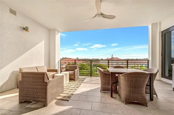 a view of a terrace with furniture